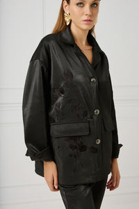 Stylish black oversize σακάκι by iRous with unique embroidery, satin lining, and distinctive metal buttons for a chic winter look.